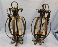 Pair of black wrought iron hanging candelabra