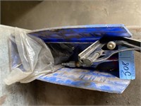 Blue container with spraygun, bolts, ruler,