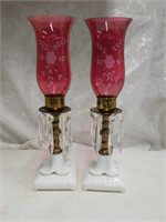 Two antique brass & white pillar candle holders
