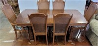 OAK TABLE AND 6 CANE BACK CHAIRS