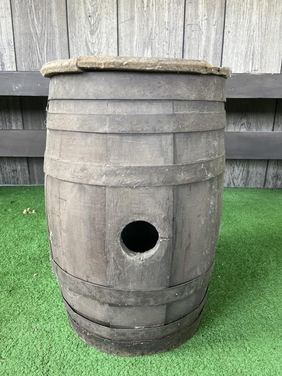 Small rustic whiskey barrel with broken lid