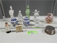 Figurines, coasters, small clock, small urns and a