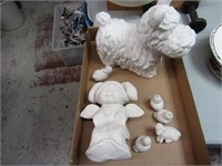 Unfired ceramic lot. Dog has been fired.