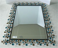 Decorative beveled wall mirror with plastic jewels