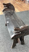Asian style project bench with carved sides, has