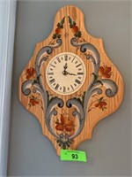 CLOCK/ AND OTHER ITEMS ON WALL/ AFRICAN BASKETS