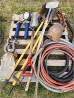 Pallet with clevis's, grease guns, hitch, shovels