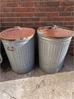 2 metal trash cans w lids