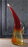 A Blenko Glass Co. Tangerine Crackle Glass pulled