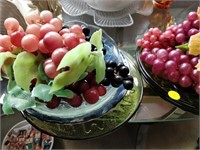 set of plates , and plastic grapes