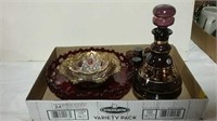 Amethyst glass decanter set and three Ruby glass