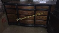 Nice curved 12 drawer dresser black and brown.