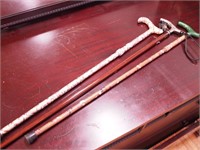 Three contemporary decorated canes, two are