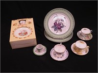 Eight china items: four cups and saucers, two by