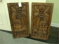 Pair of intricate carved wood panels.