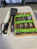 Various kitchen utensils 
Knives 
Forks
