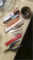 Tweezers, nail clippers, files, etc..