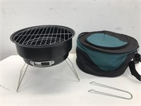 Portable charcoal grill in carrying case
