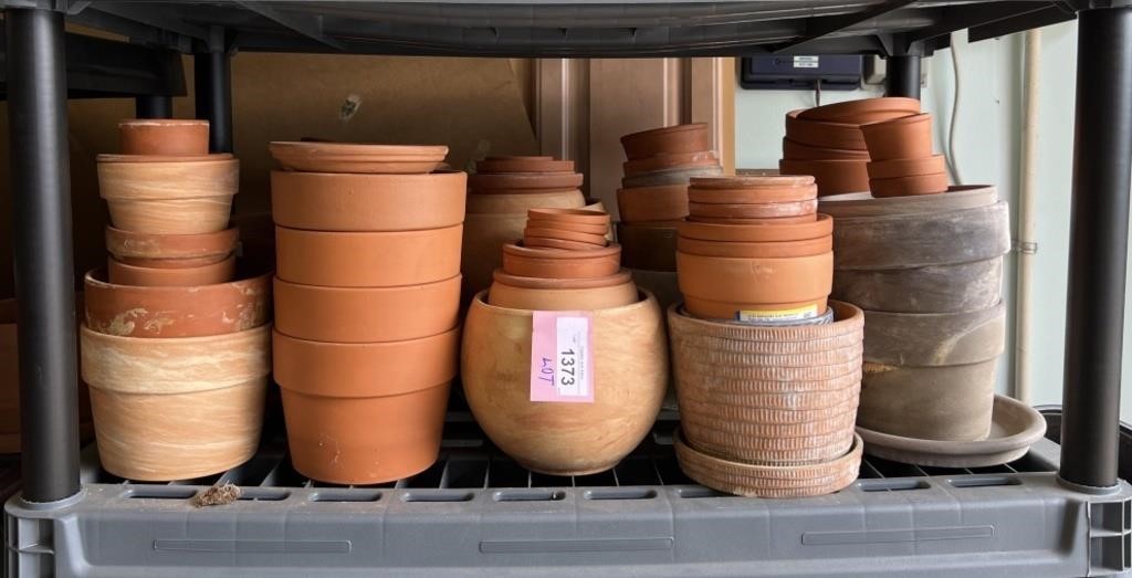 Shelf Of Clay Terracotta Plastic Planters