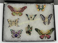 EIGHT BEJEWELED AND ENAMELED BUTTERFLY BROOCHES