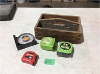 Wooden toolbox, tape measures and magnetic