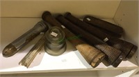 Antique shuttles, insulator and flashlight and