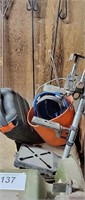 sand paper, plastic pail, hard hat and drill stand