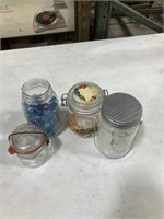 Glass jar with blue rocks, jars with lids, jar