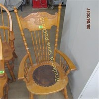 CONTEMPORARY ROCKING CHAIR. (TEAR IN THE