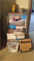 Queen size air mattress with pump, magazines