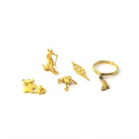 Lot of 14kt and 18kt gold charms, 5.7 grams total
