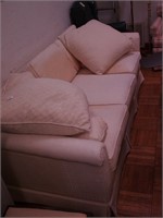 Three-piece sofa with off-white upholstery