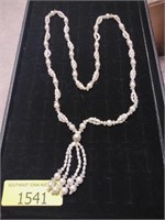 Long white bead necklace