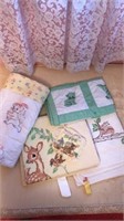 Four needlepoint quilts and a small pillow
