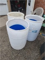 5 plastic barrels