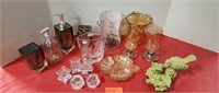 Assorted candle holders and vases.