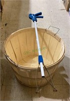 Bushel basket with metal handles and a trigger