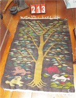 woven rug 46x33” (old mend on corner) tree & bunny