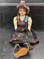 OLDER HARD PLASTIC DOLL WITH HAND WOVEN CLOTHES