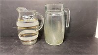 Two small glass pitchers