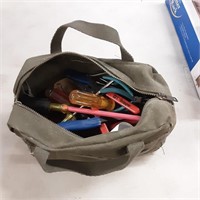 Tool satchel packedwith pliers, screwdrivers and
