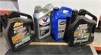 1 Sealed and 3 Near Full Jugs of Motor Oil