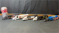 5) semi trucks