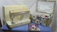 Singer Futura 900 sewing machine and accessories.