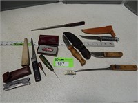 Variety of knives, sharpening tool, small wood han