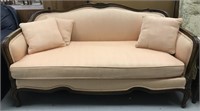 Peach Victorian couch with scallop design