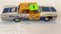 Tin 1950's Ford toy car w/Pepsi Cola graphics-