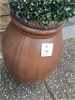 Large outdoor decorative vase with topiary top