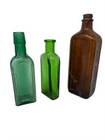 Old colored glass bottle grouping