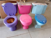 3 colorful real porcelain toilets